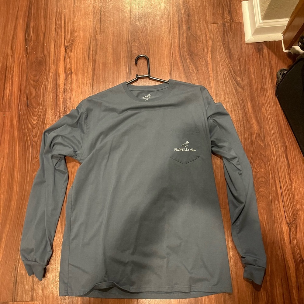 Properly tied Men’s long sleeve shirt 
Size large